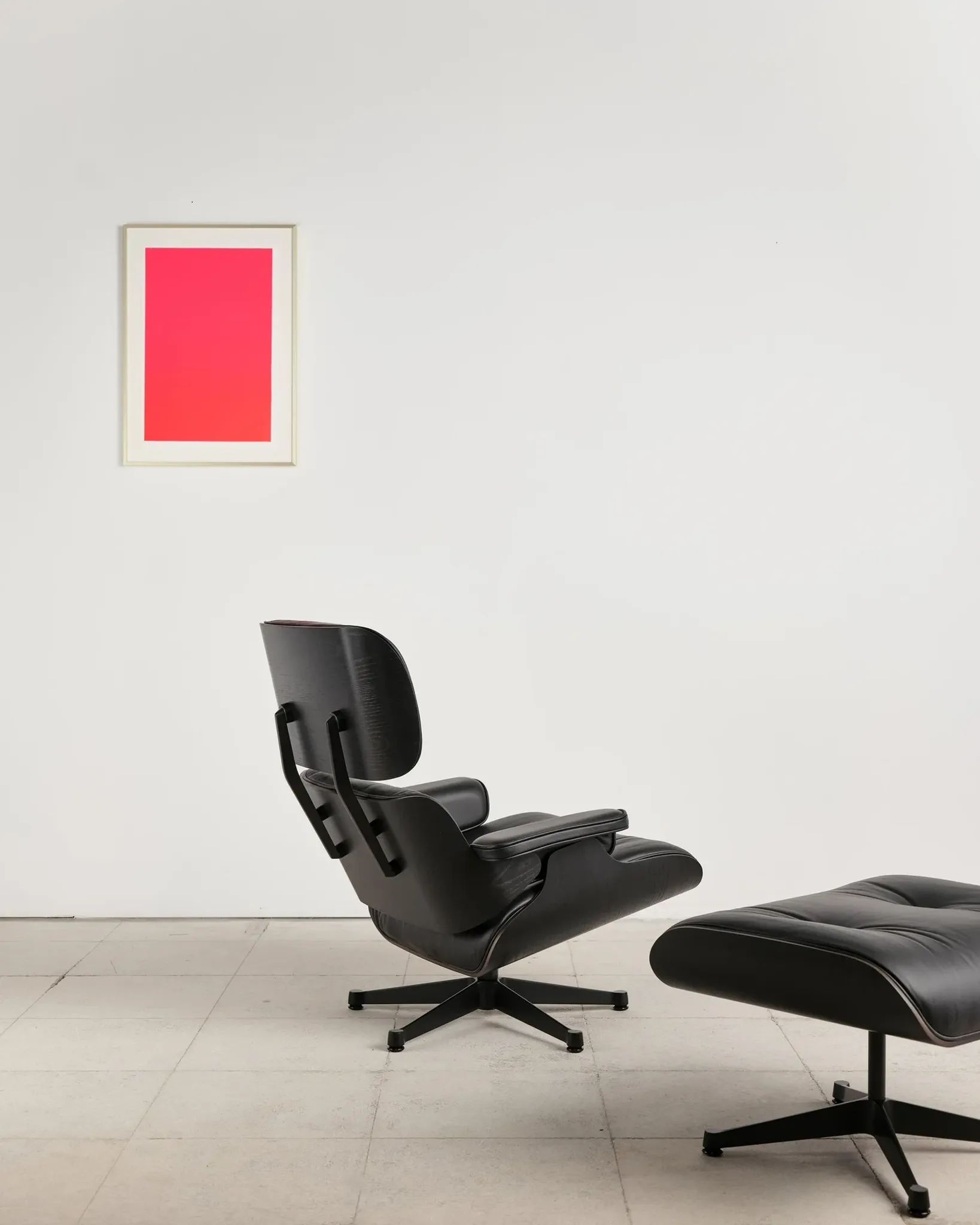 Lounge Chair and ottoman in black leather by Charles & Ray Eames, Vitra