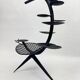 Candlestick sculpture in perforated iron clover motif