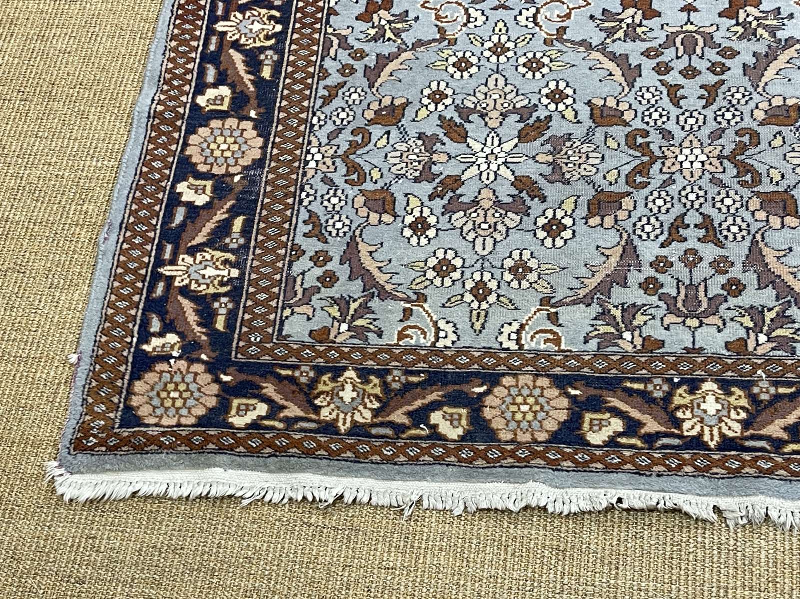 Handmade wool oriental carpet (wear defects)