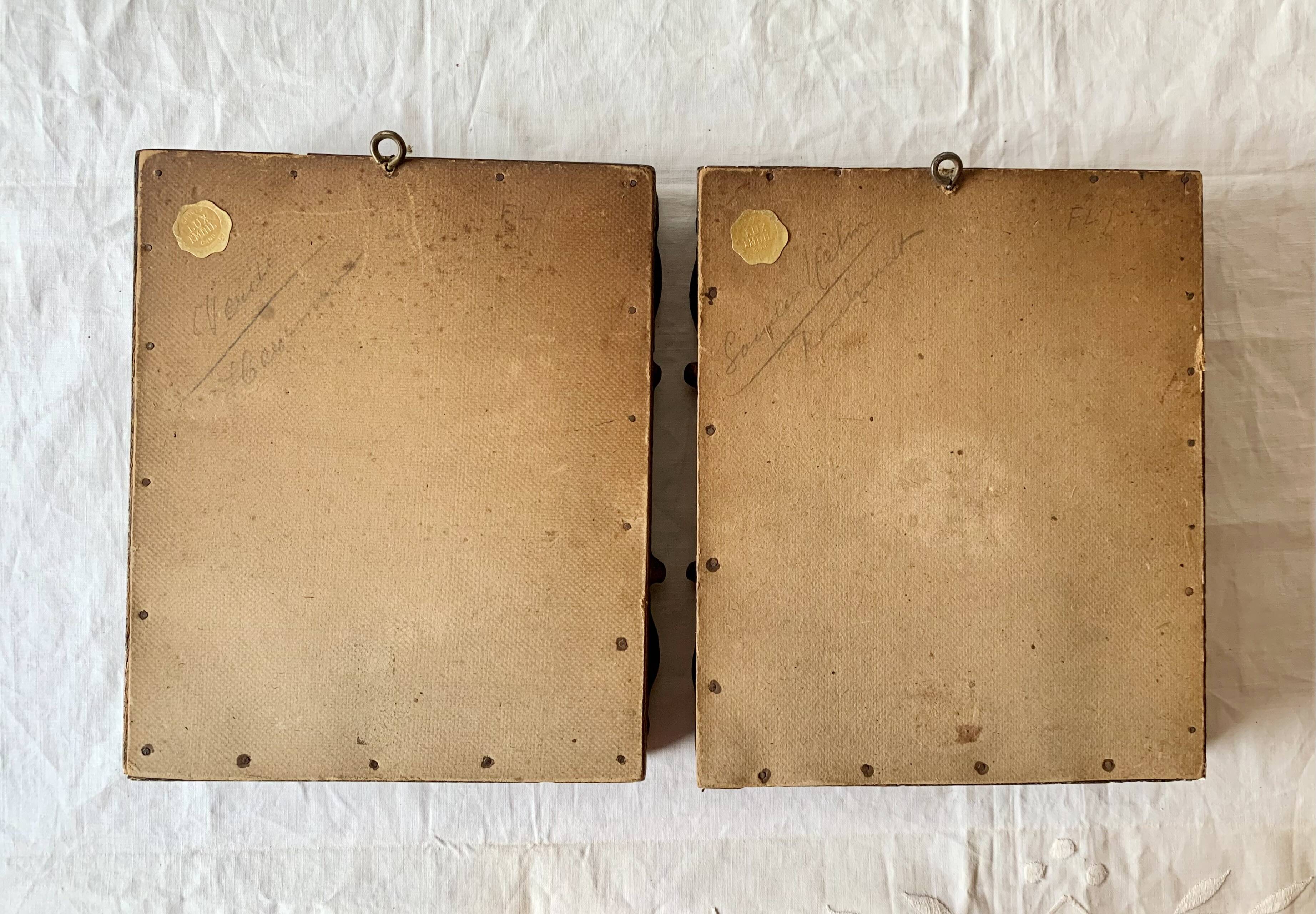 Pair of old carved wooden and plaster frames