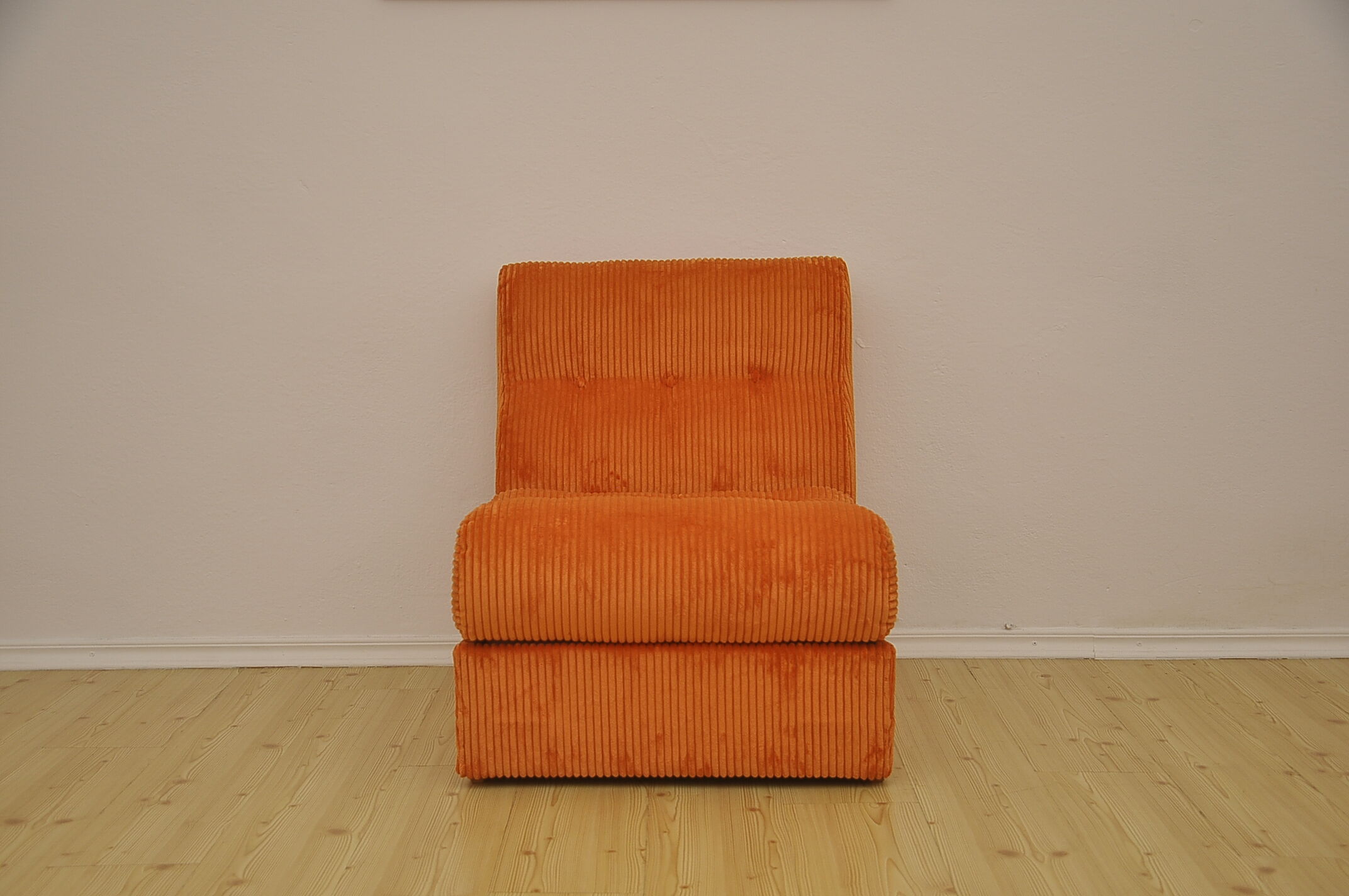 Orange corduroy modular sofa, 1970s.