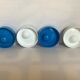 Four round blue and white egg cups from the 1970s.