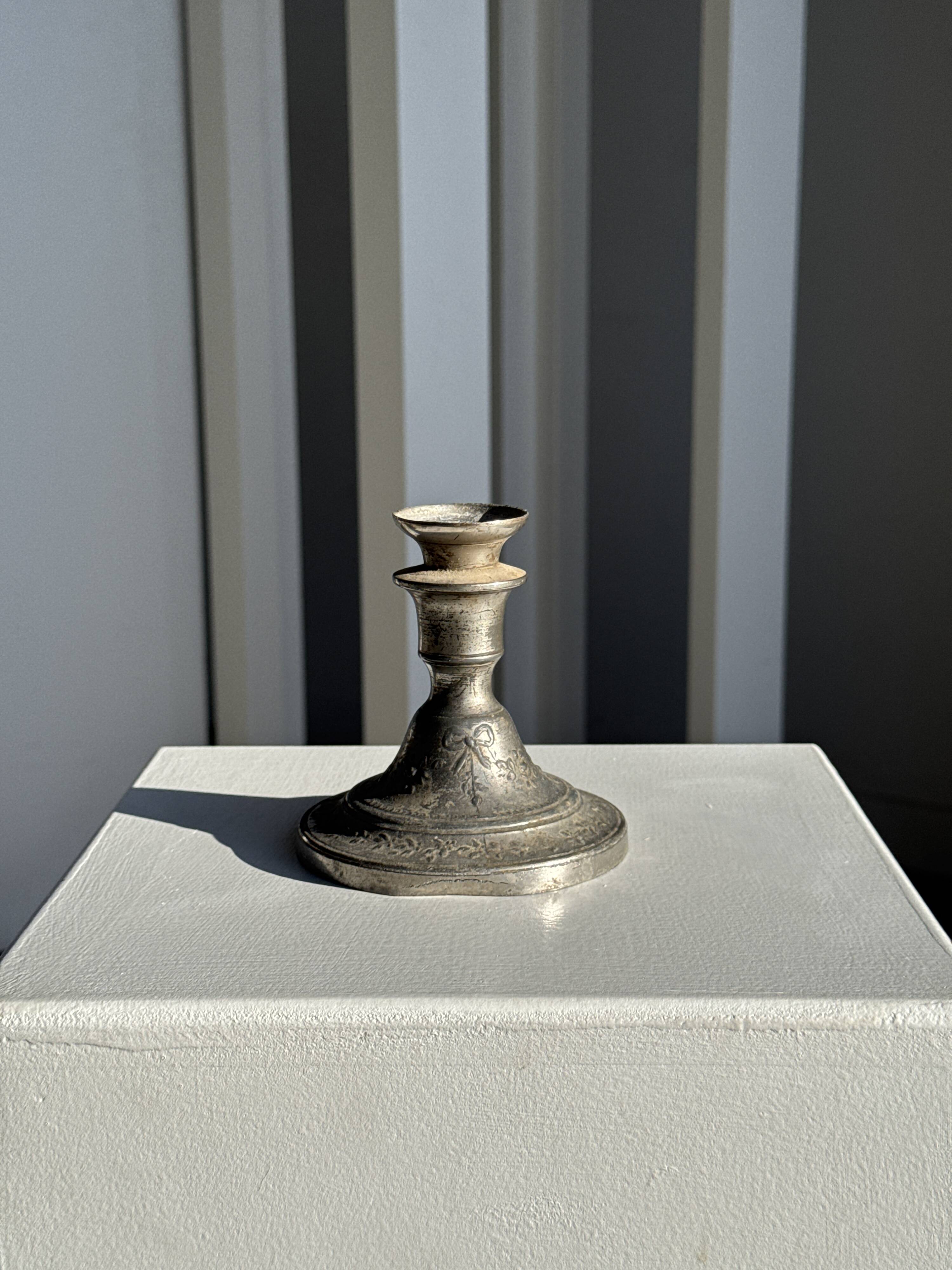 Small antique candle holder engraved in silver-plated metal, in its original condition.
