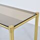 Table basse italienne du milieu du siècle en laiton tubulaire et verre fumé. Rétro.