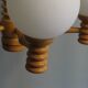 Space age chandelier in 5-arm wood with white frosted opaline glass spheres.