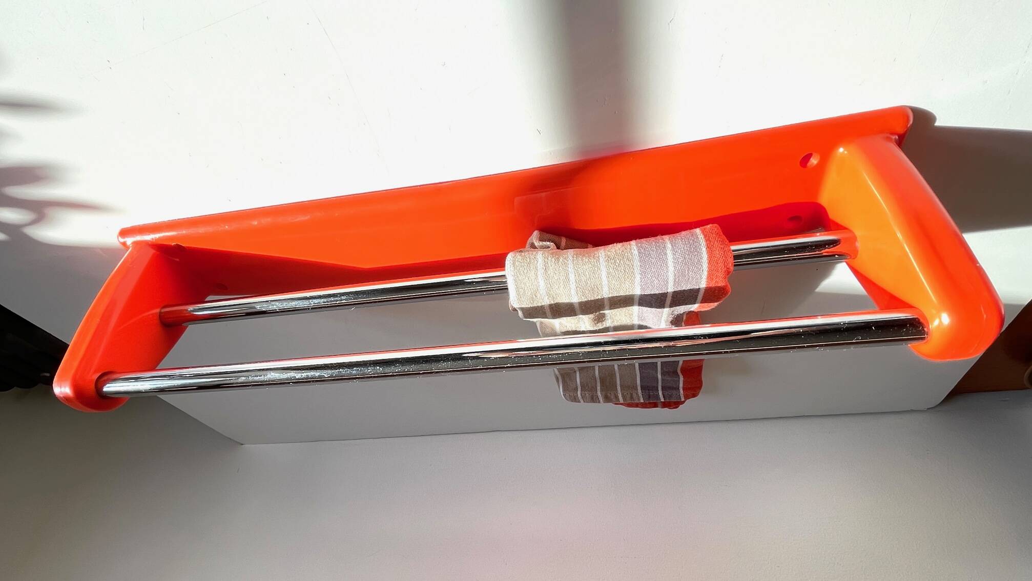 Orange towel rack by Syla from the 70s