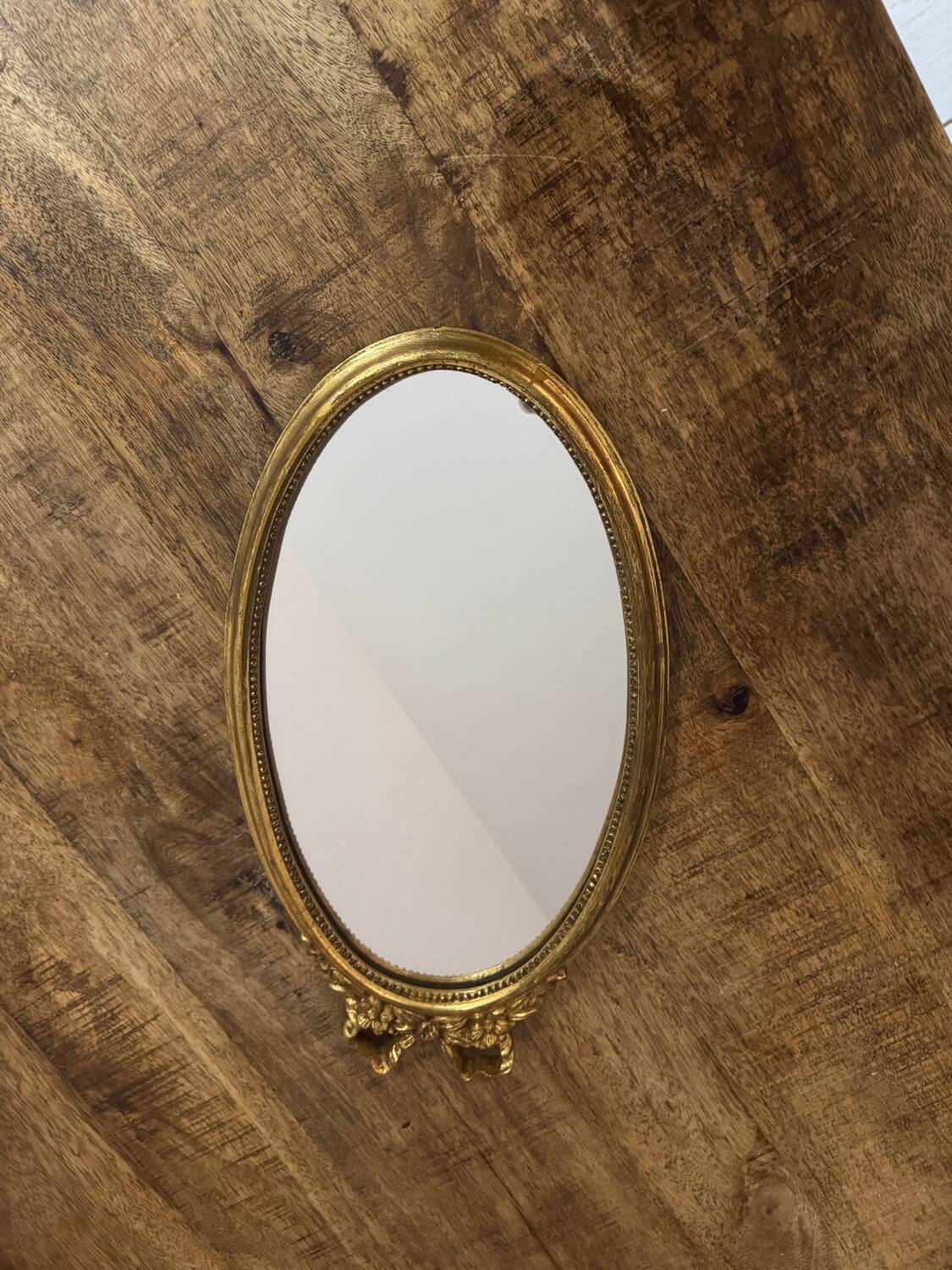 Oval gold knot mirror
