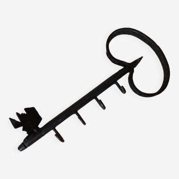 Old wall key holder in the shape of a vintage metal key 4 hooks