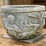 Reconstituted stone planter with hunting decoration