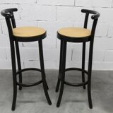 Pair of Baumann Dialog model stools in black and yellow and blue imitation leather, 1990