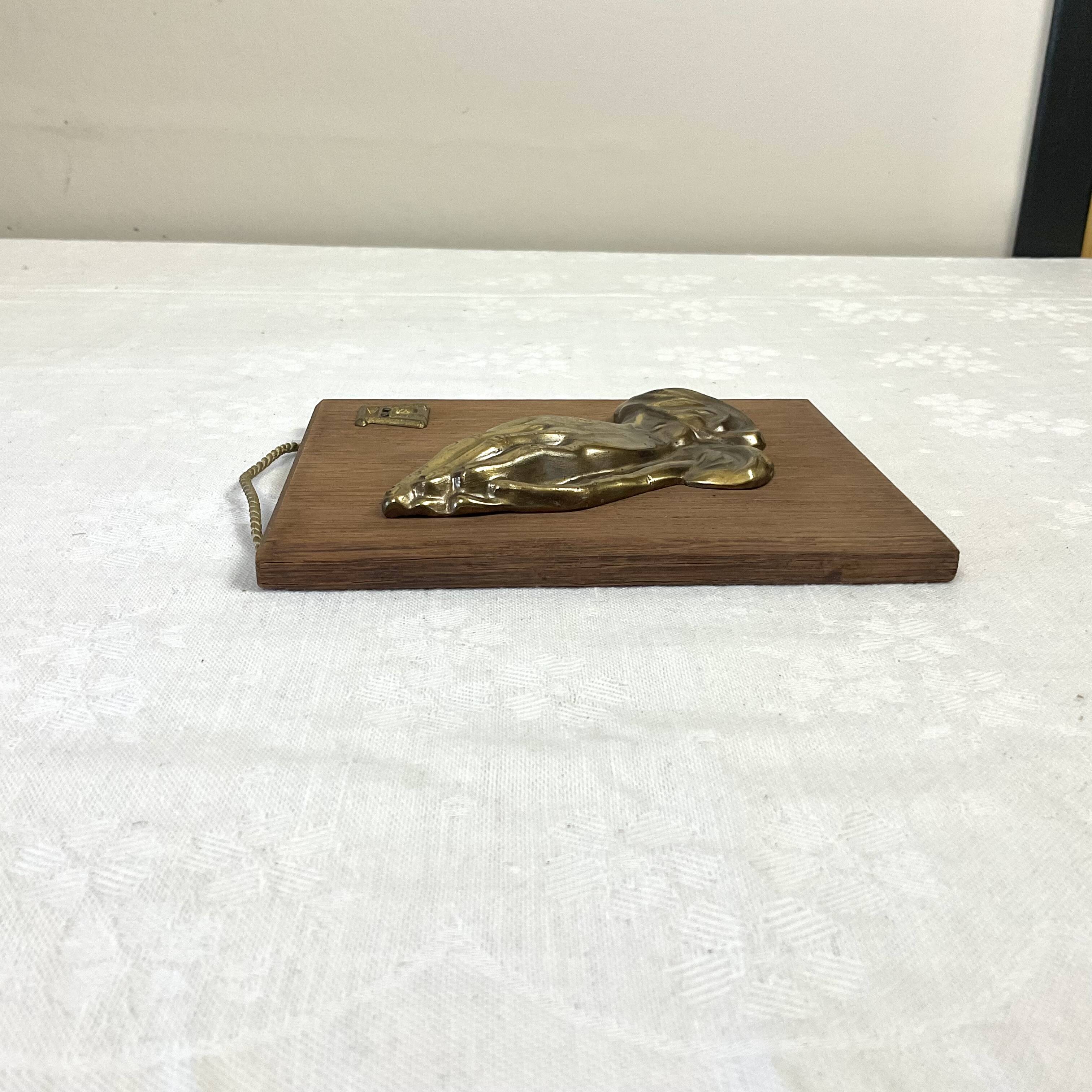 Suspension of praying hands