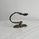 Antique black patinated metal coat hook.