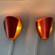 Pair of orange plexiglass and curved brass wall lights, 1950s, Germany