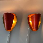 Pair of orange plexiglass and curved brass wall lights, 1950s, Germany