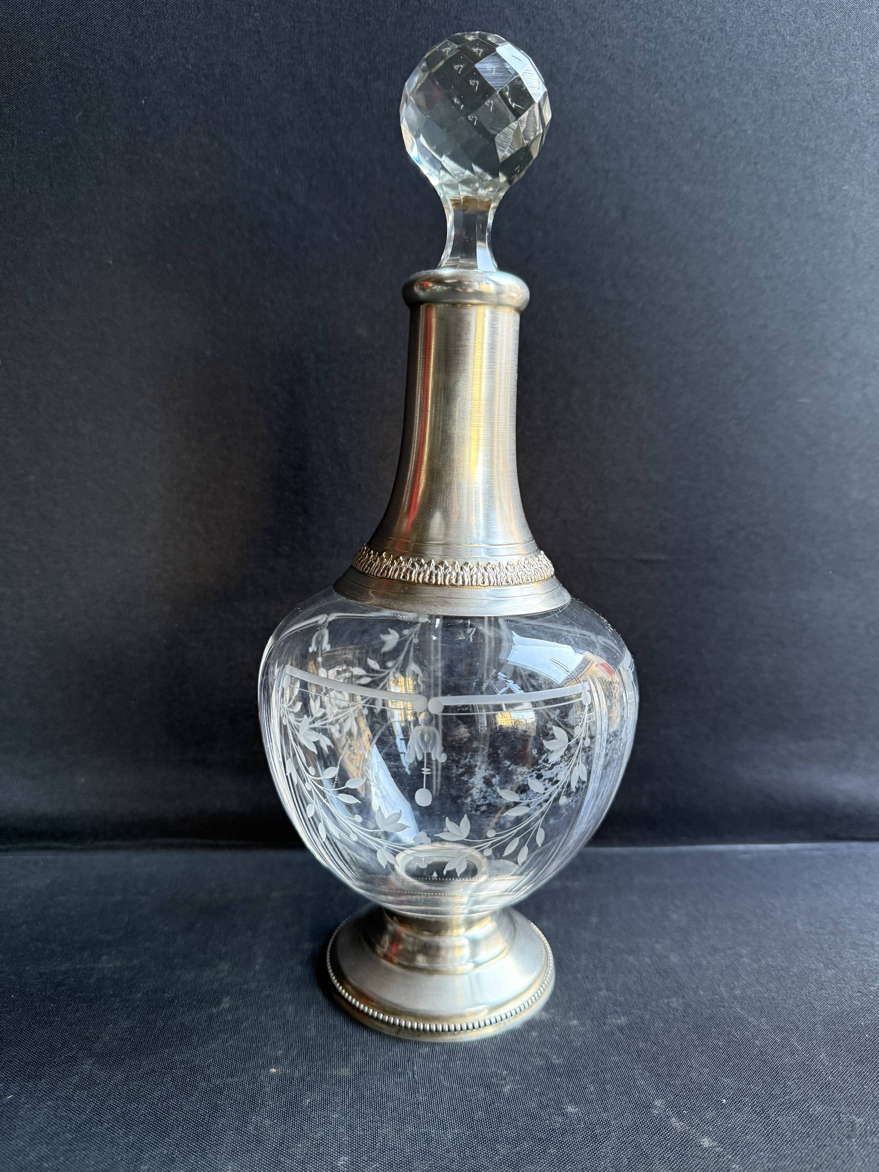 Cut crystal carafe with silver frame