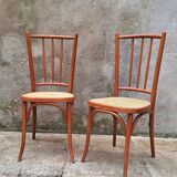 Pair of wooden and cane bistro chairs