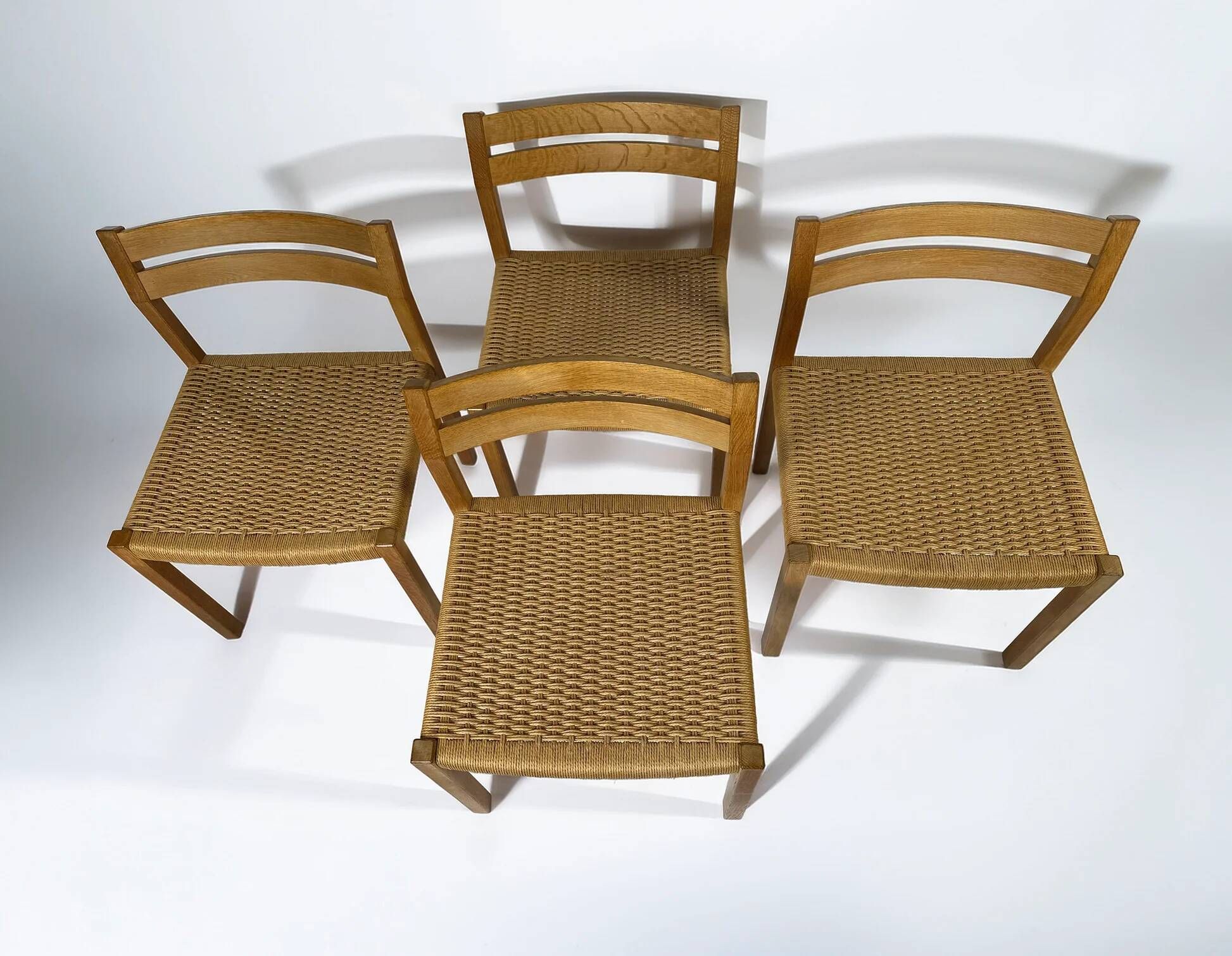 Dining chairs J.H. Møller model 401 in oak with original Danish cord — Denmark, 1970s