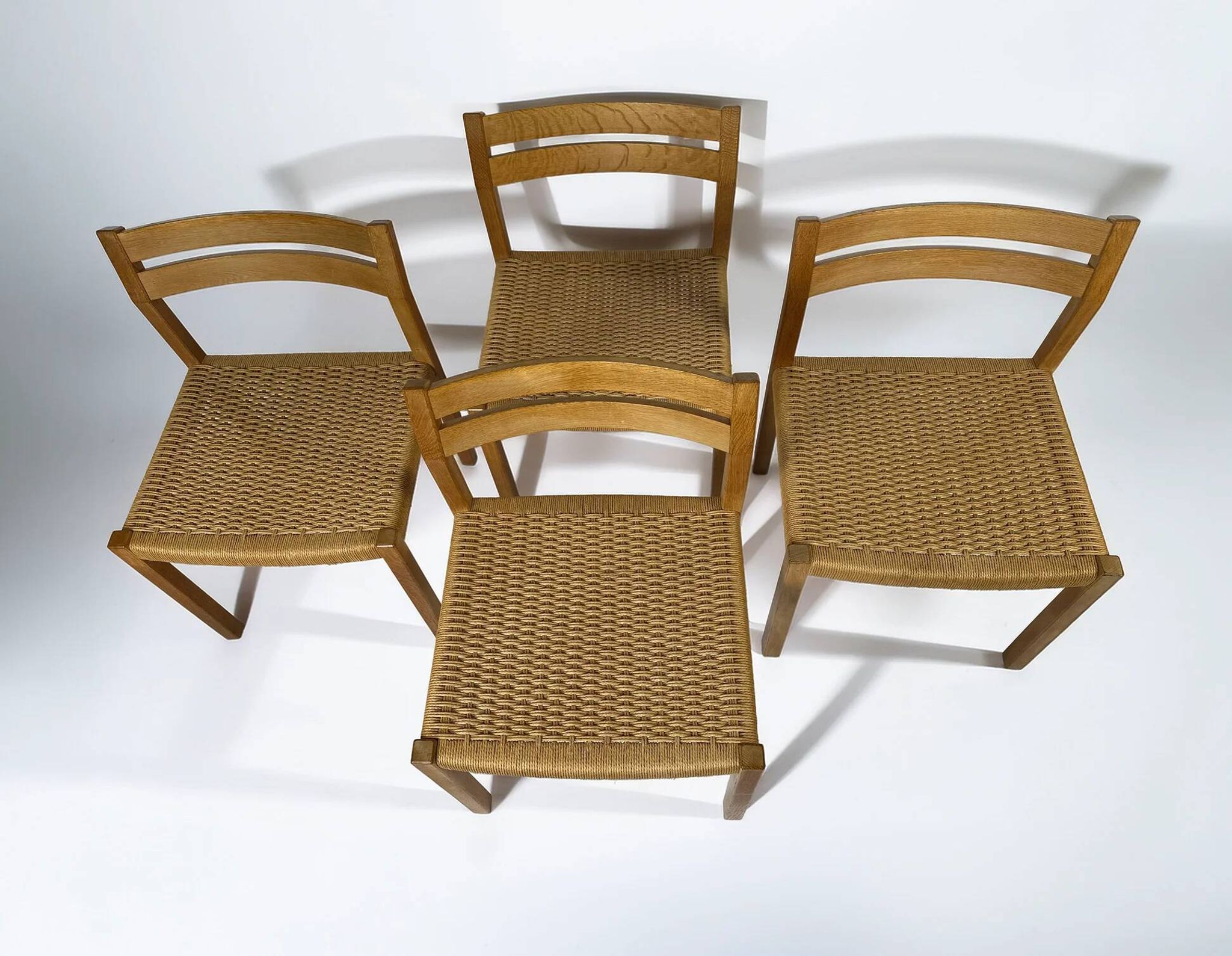 Dining chairs J.H. Møller model 401 in oak with original Danish cord — Denmark, 1970s
