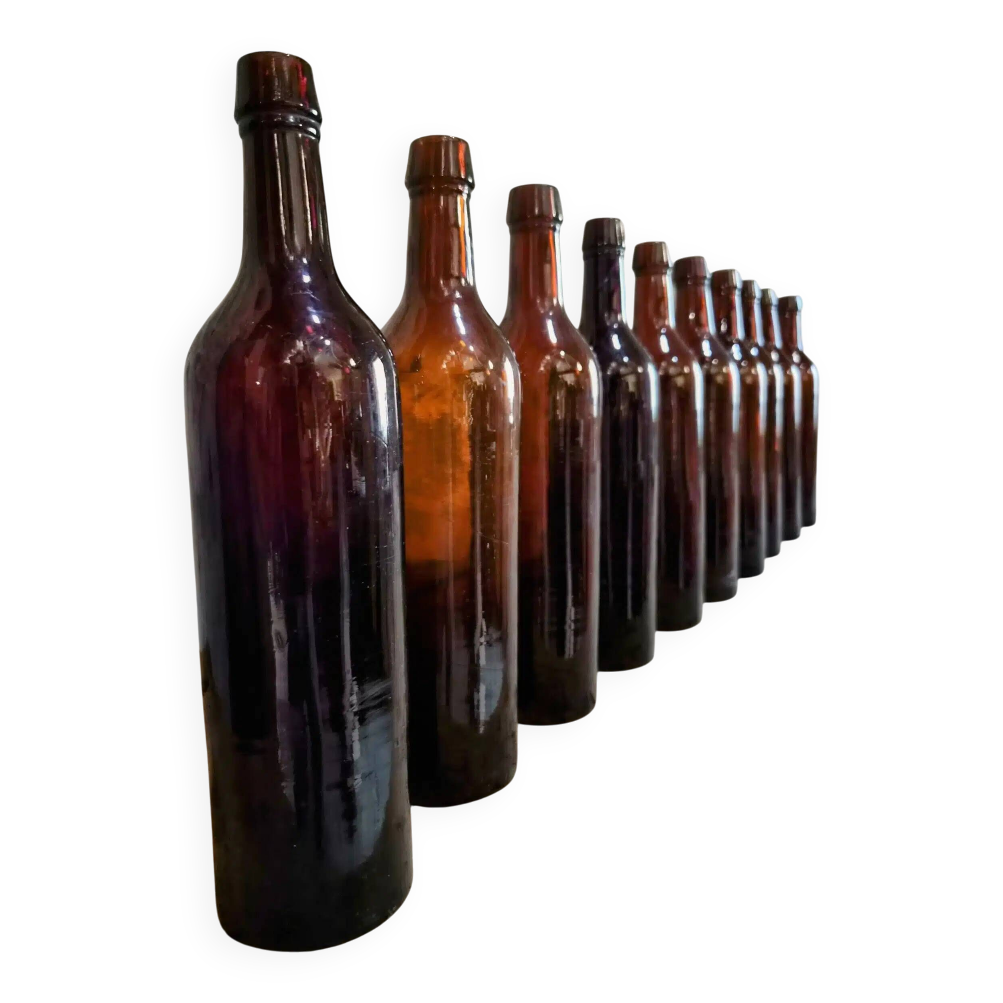 Set of 10 bottles of old Bordeaux French wine in ruby brown glass, 19th century.