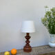 Vintage turned wooden lamp and white lampshade
