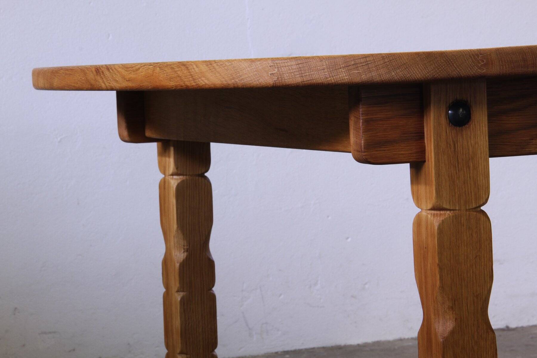 Vintage Danish brutalist oval extendable oak dining table in the style of Henning Kjærnulf, 1960s