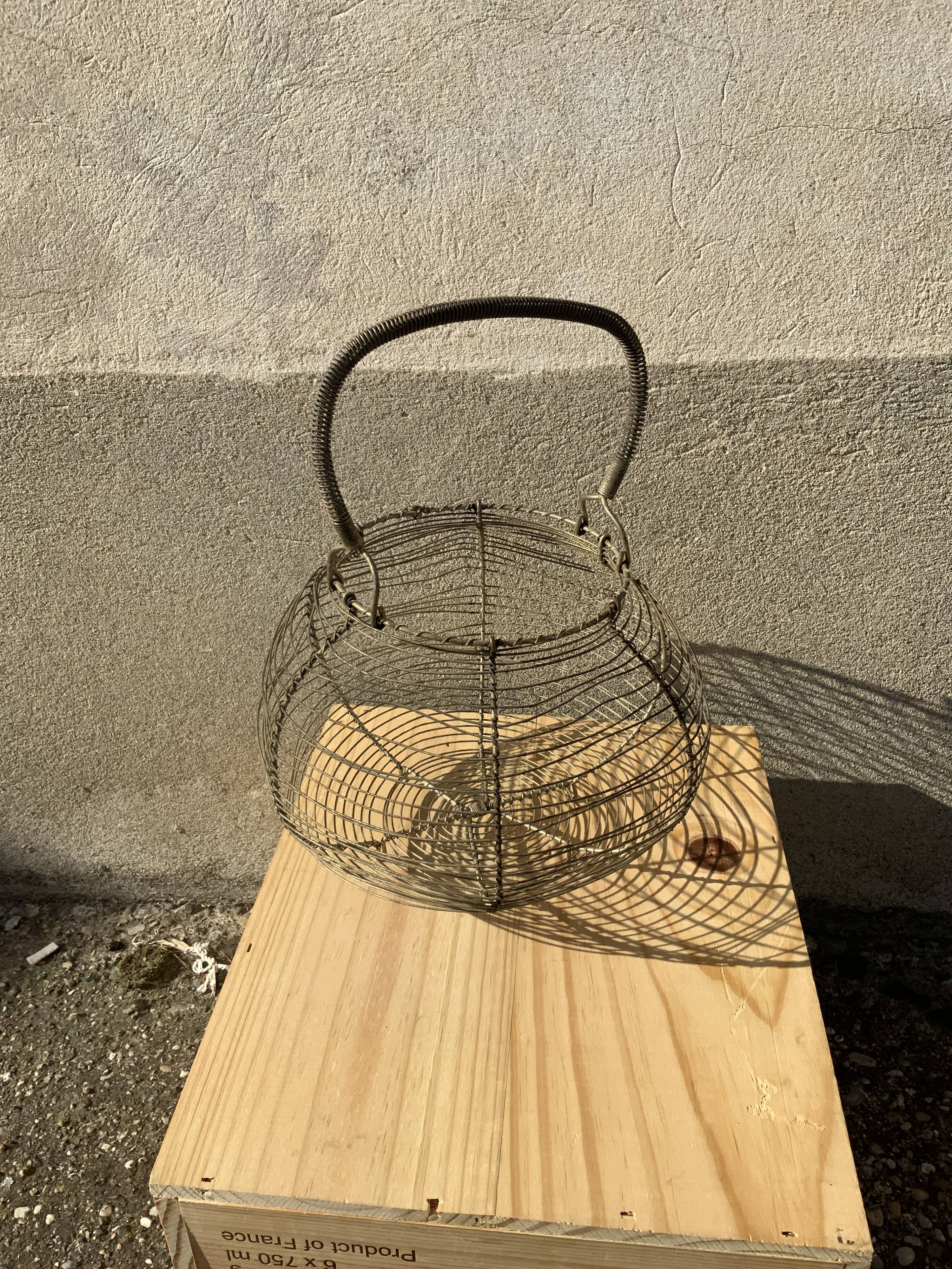 Vintage iron egg basket with hanse antique