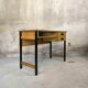 Vintage desk in modernist style made of wood.