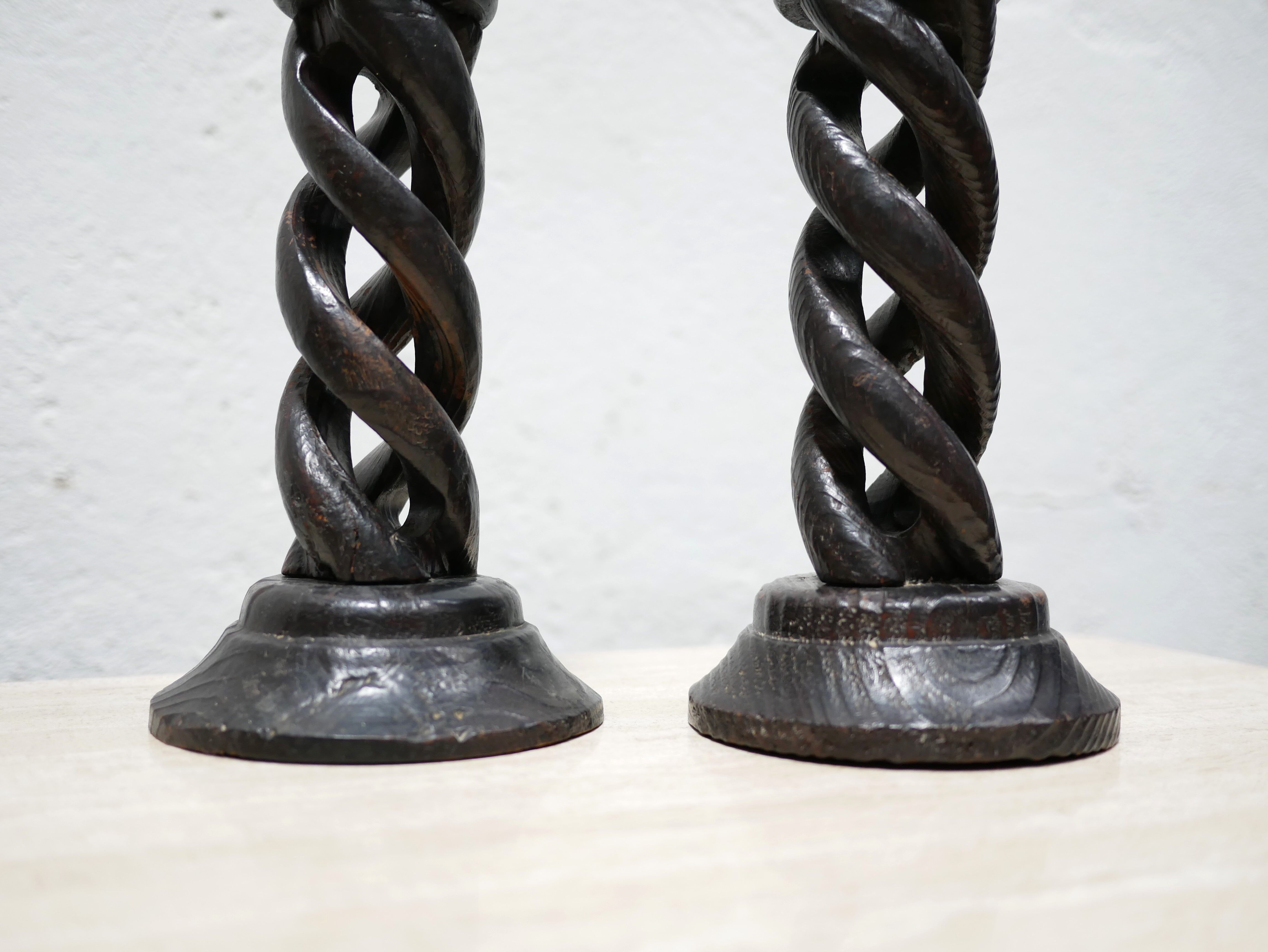 Pair of antique turned wooden candle holders