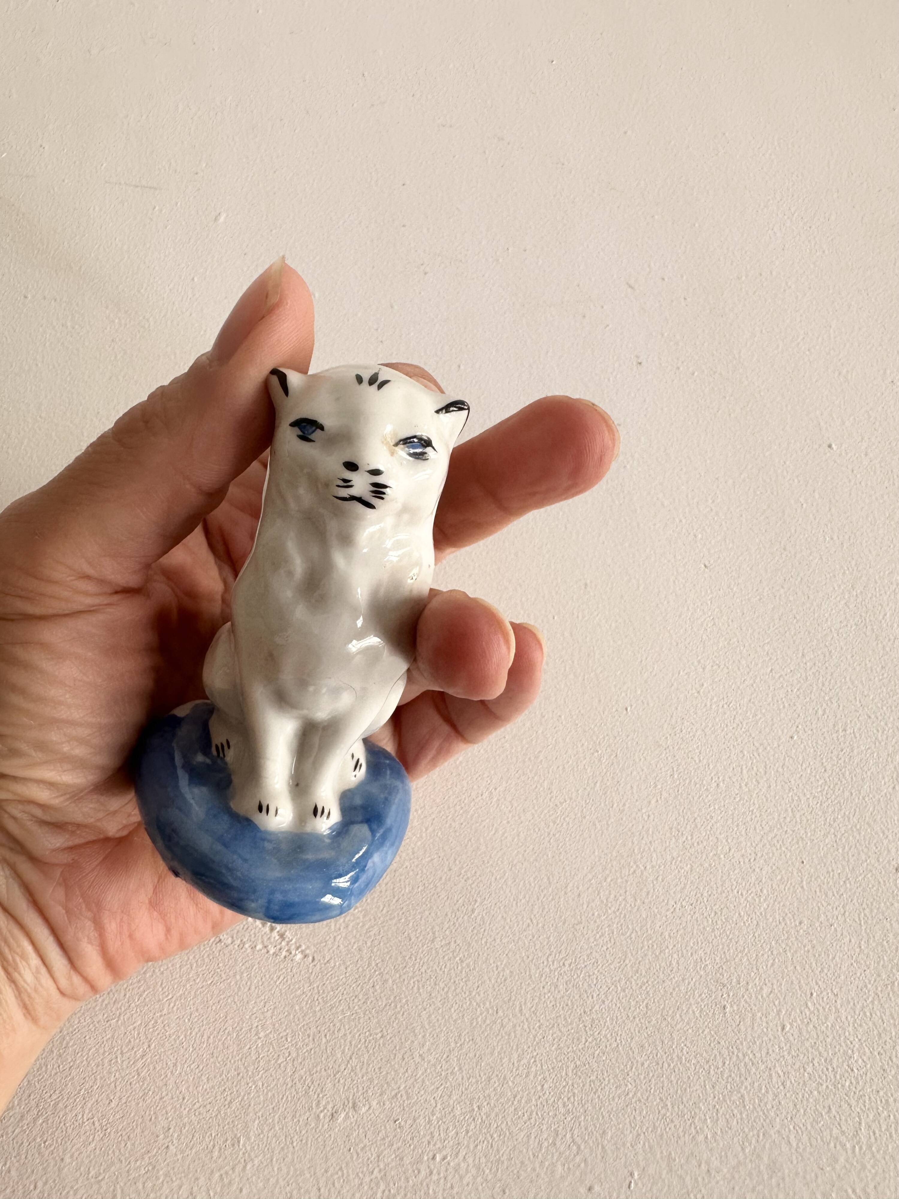 Small ancient glazed ceramic cat from the 19th century.
