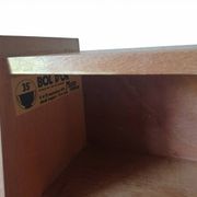 Vintage 1960s secretary desk with an angled design, light wood, and tapered legs.