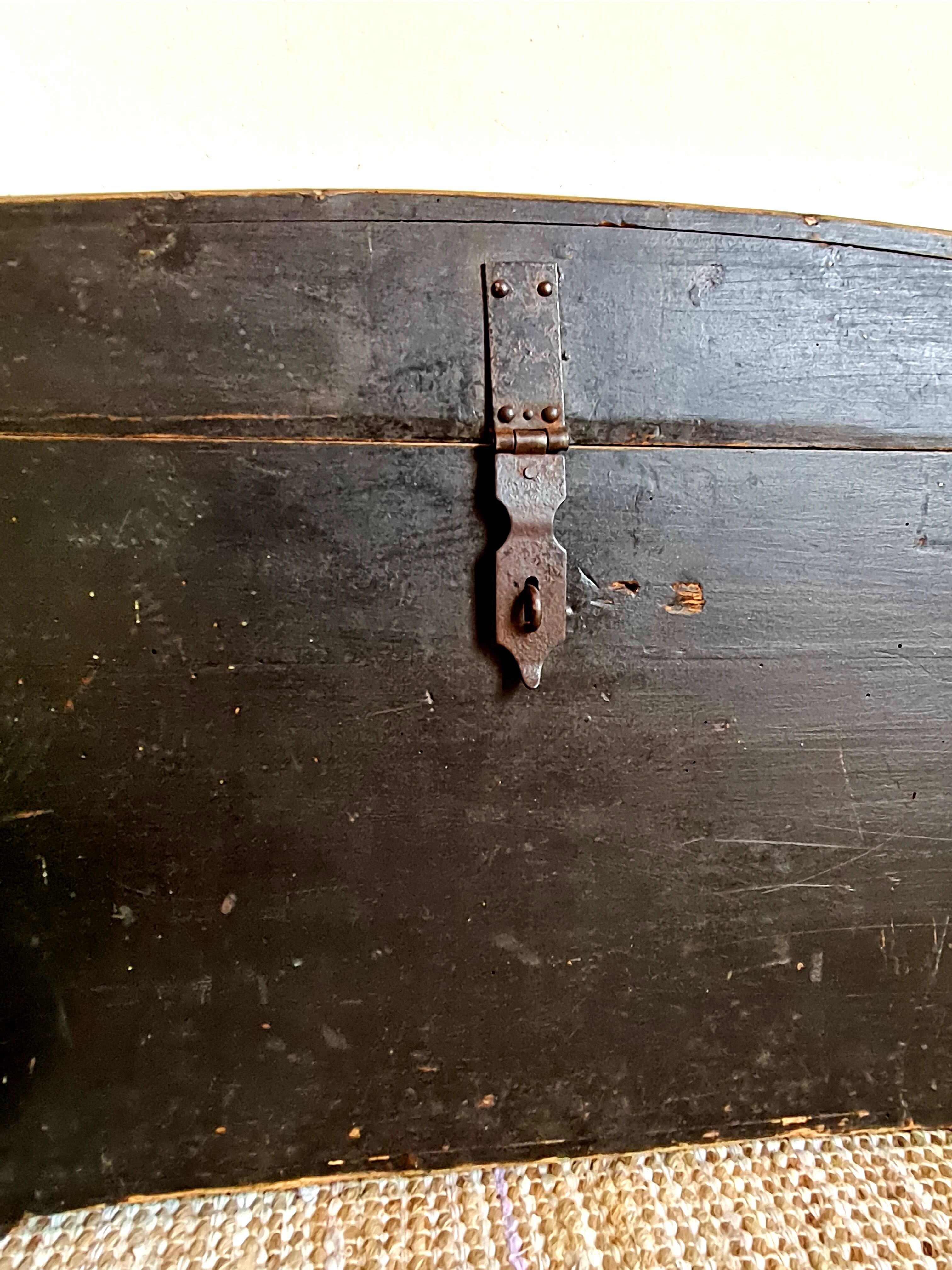 Old chest in black wood