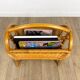 Vintage caramel-colored bamboo and rattan magazine rack