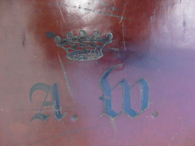 Old monogrammed leather travel suitcase and barony crown