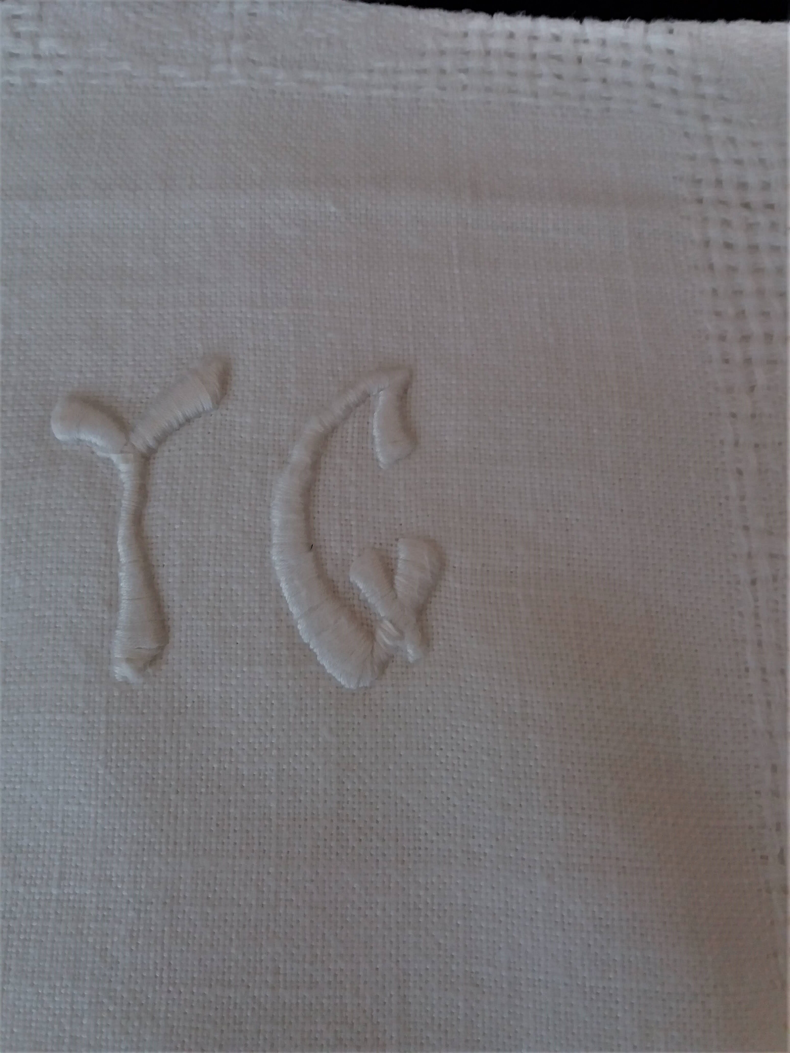 Series of six hand embroidered YG monogrammed YG linen table towels