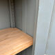 Small antique wardrobe with a faded white patina.