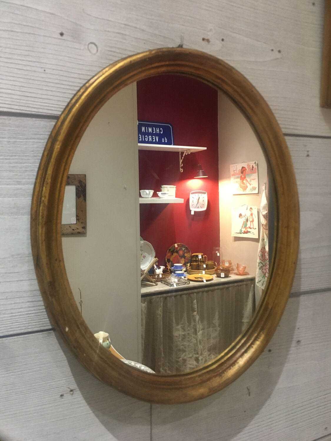 Golden oval mirror 26x32cm