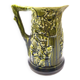 pitcher green slip Sarreguemines scene in relief majolica
