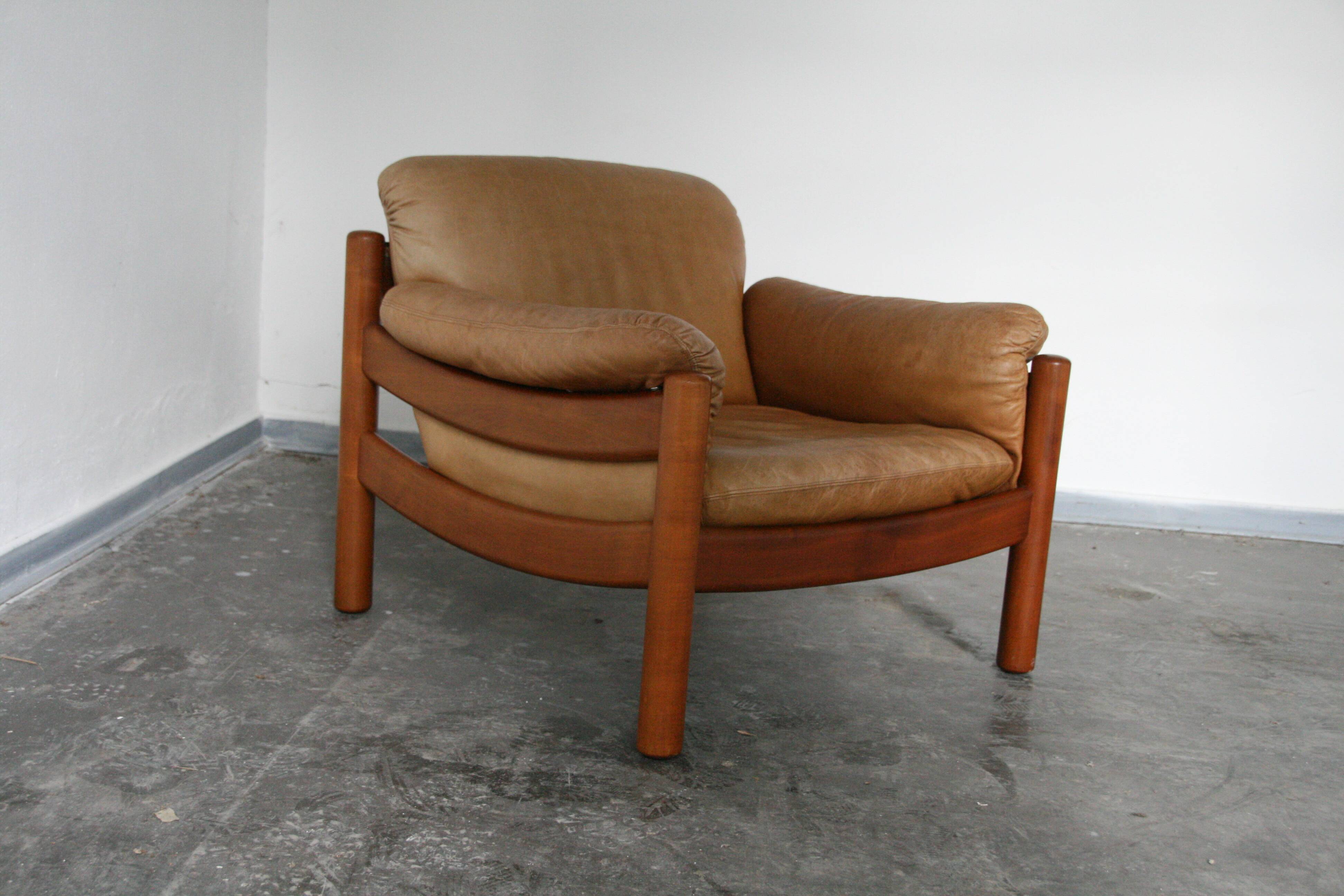 Teak and leather club armchairs