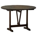 Round table with a tilting top from a 19th-century provincial French winemaker in oak.