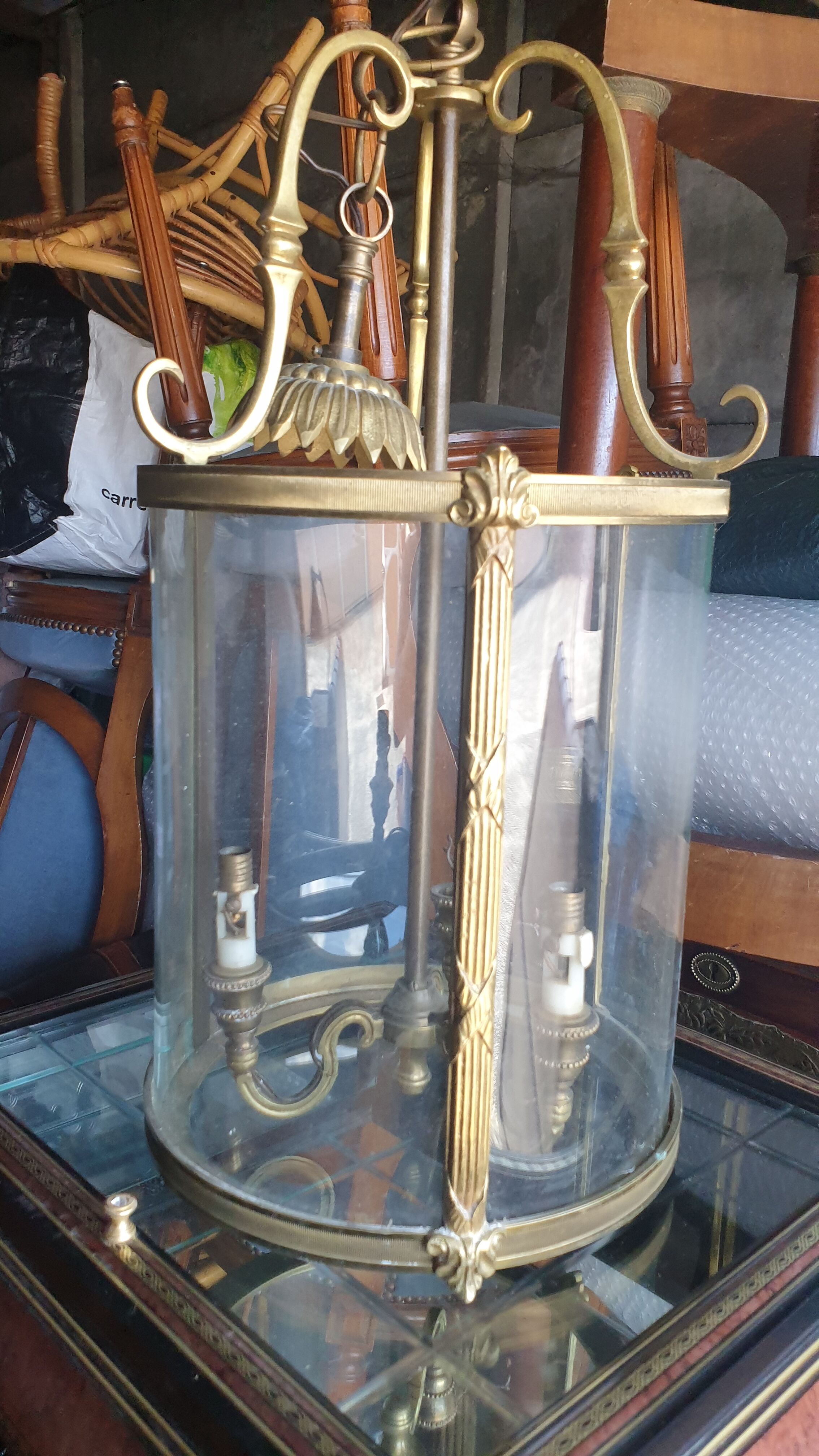 Suspension in glass and brass