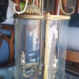 Suspension in glass and brass