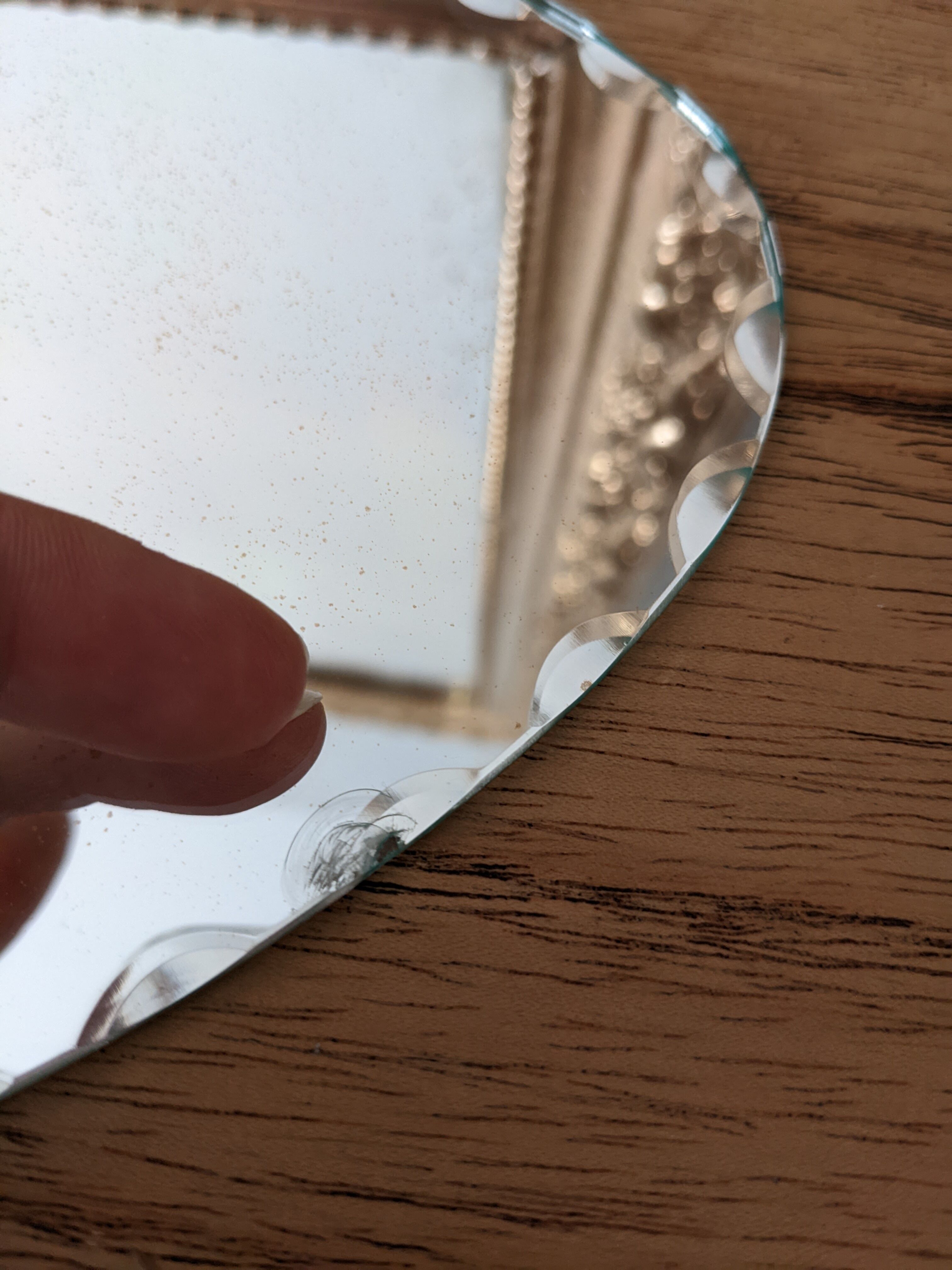 Vintage chiseled bevelled mirror under oval velvet