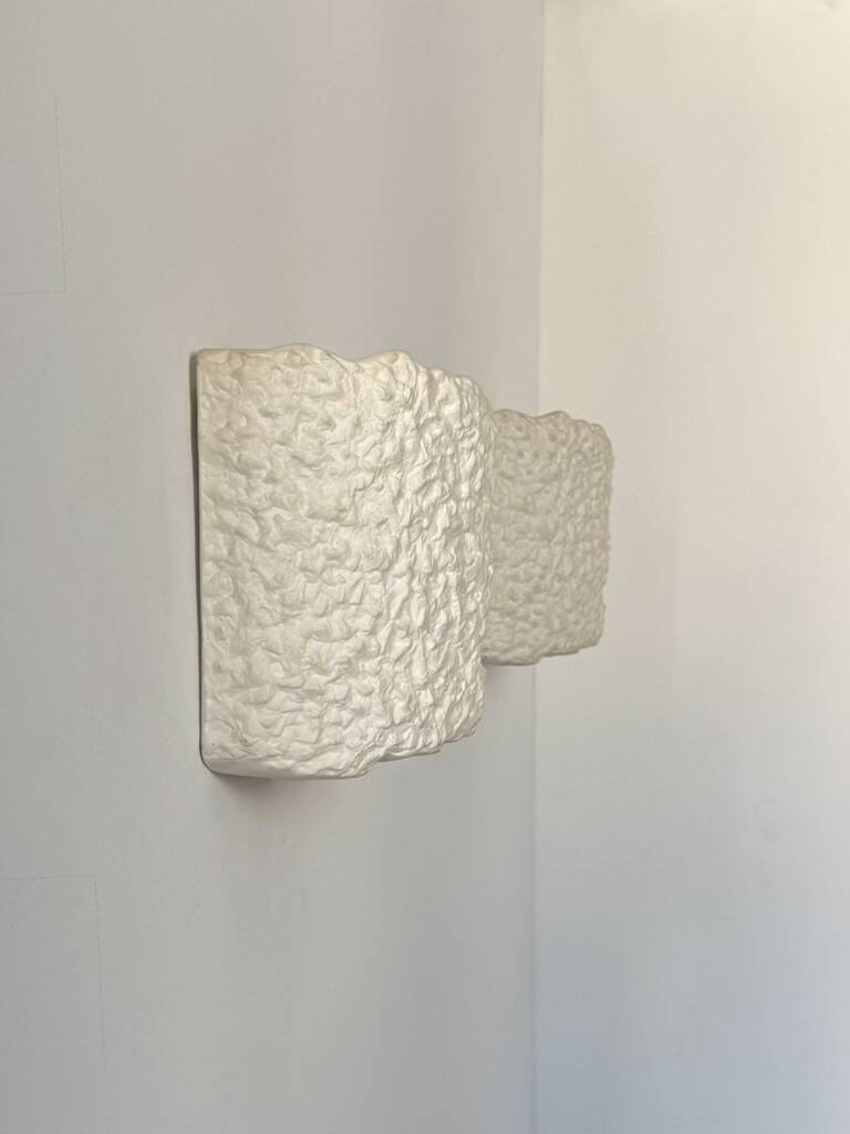 Pair of vintage wall lights in smooth plaster and stone imitation, France, 1970.