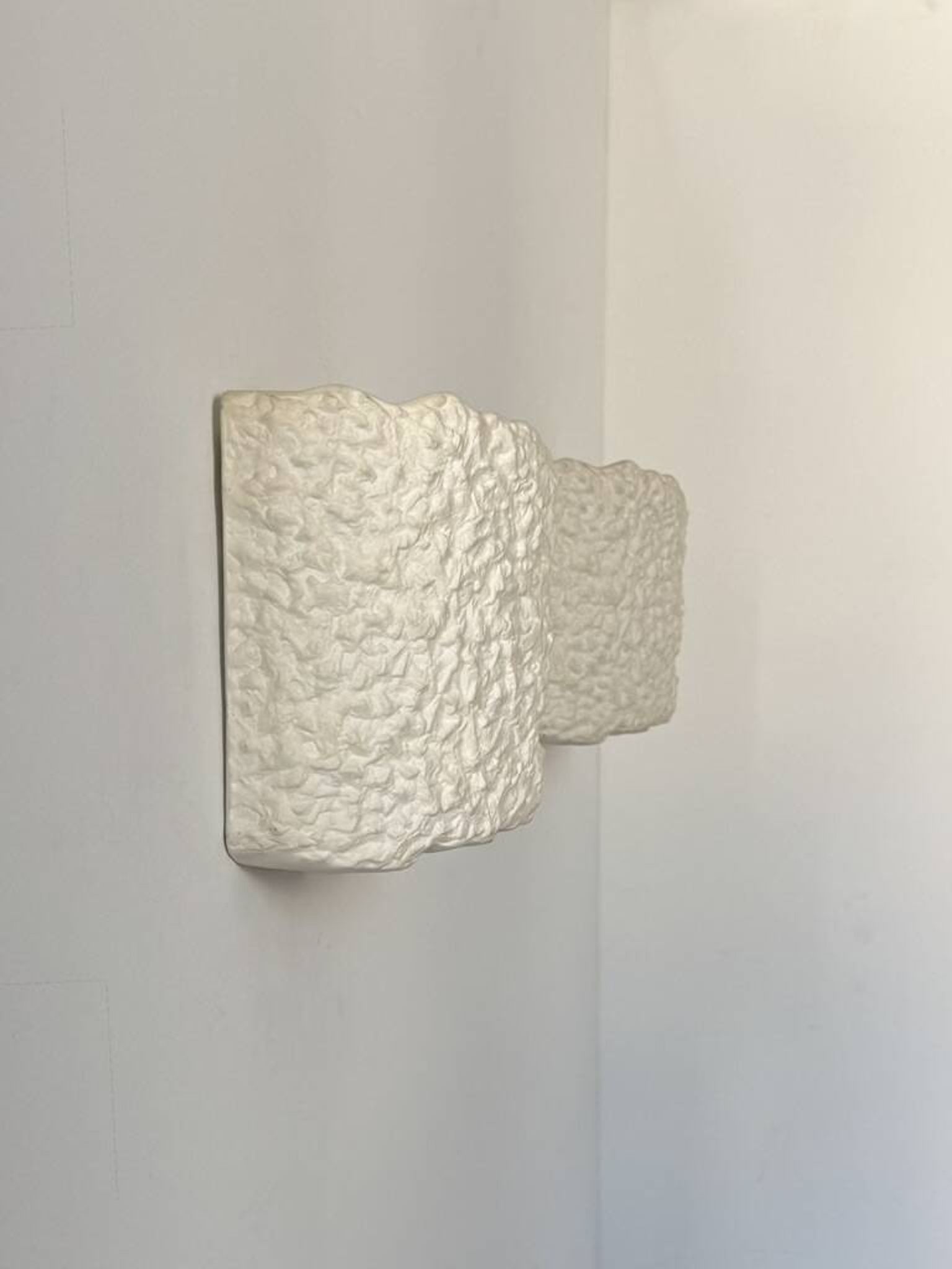 Pair of vintage wall lights in smooth plaster and stone imitation, France, 1970.