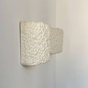 Pair of vintage wall lights in smooth plaster and stone imitation, France, 1970.