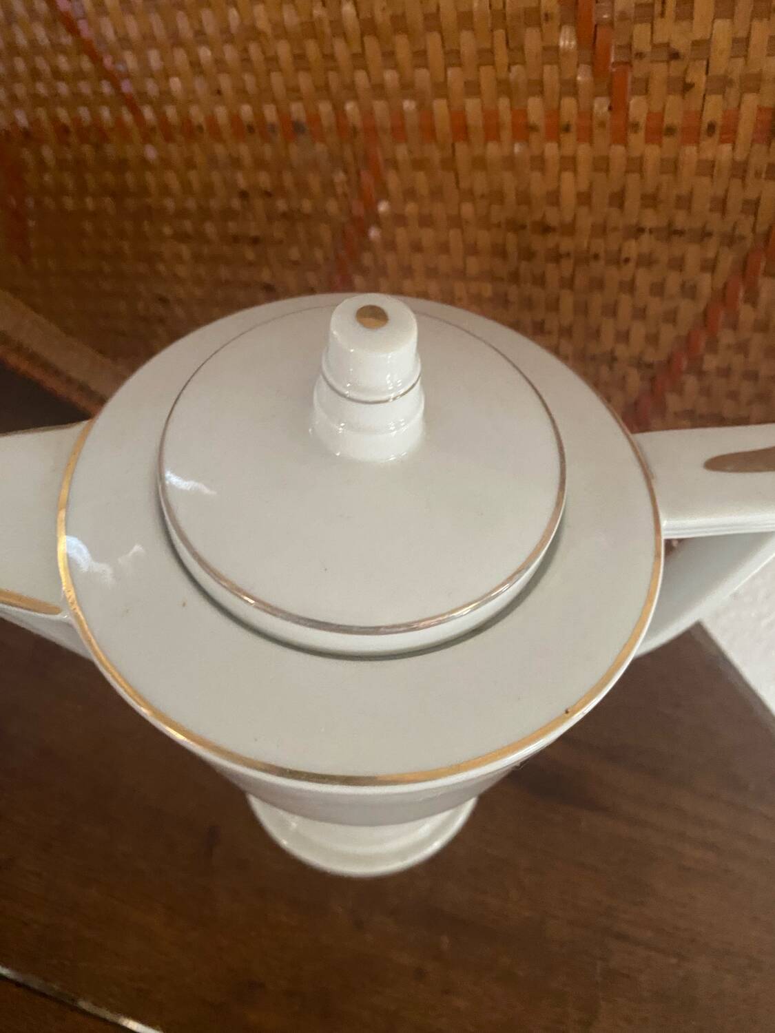 White and gold porcelain coffee pot in art deco style.