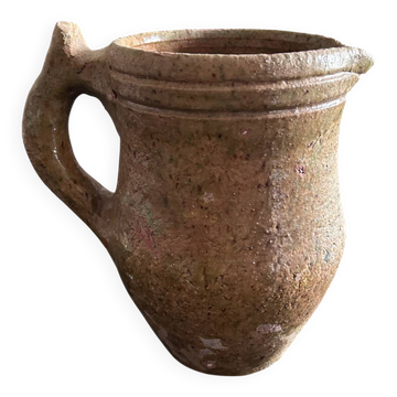 Antique pitcher in raw stoneware