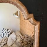 Patinated gilded mirror in wood and plaster