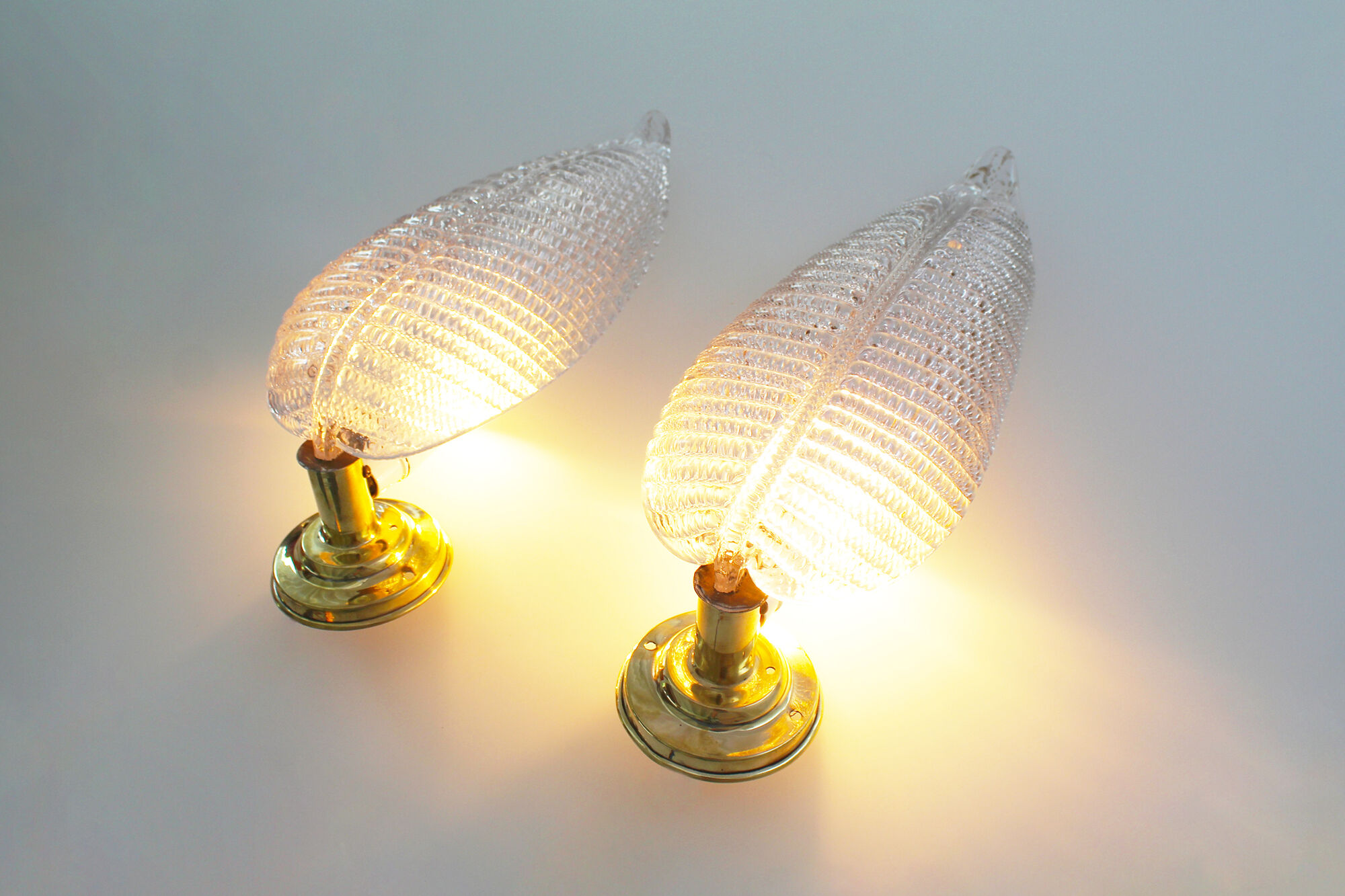 Pair of brass and muranoglass shell sconces