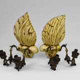 Pair of Hollywood Regency sconces in carved, painted and patinated wood, 1950s